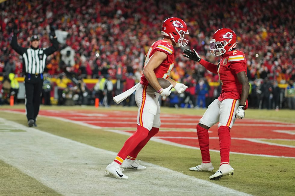 Kansas City Chiefs wide receiver Justin Watson is congratulated by teammate Xavier Worthy (1)...