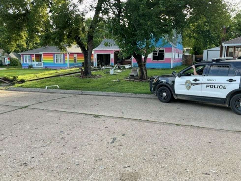 Topeka police officers on Wednesday morning were guarding a heavily damaged house at 1204 S.W....