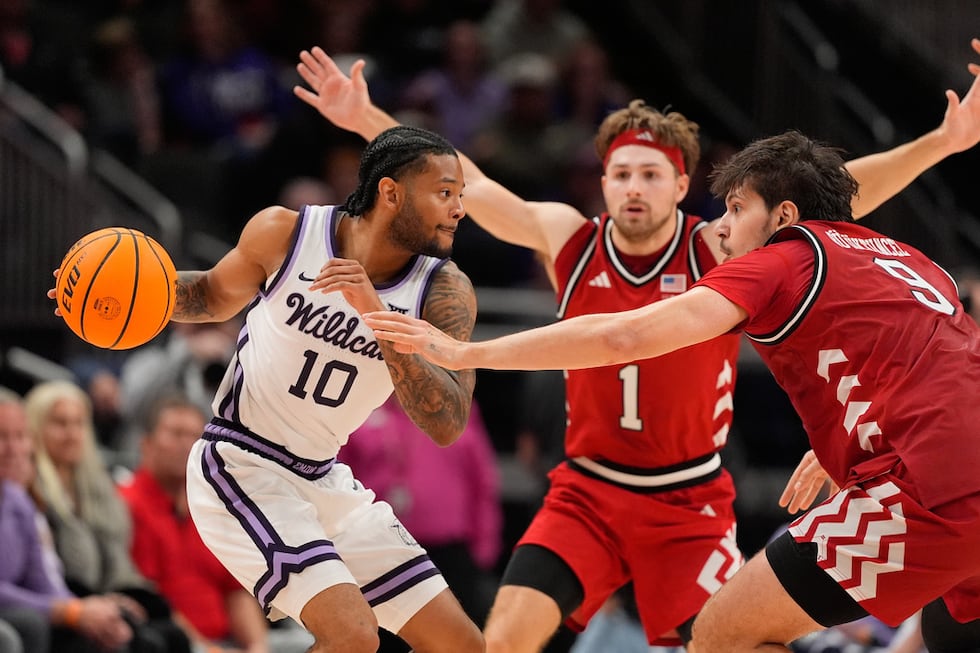Kansas State guard David Castillo (10) looks to pass around Nebraska forward Berke Buyuktuncel...