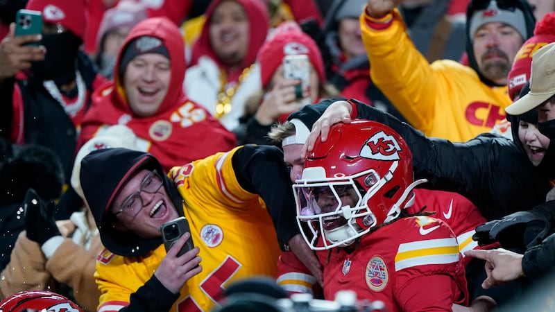 Kansas City Chiefs wide receiver Xavier Worthy (1) is congratulated by fans after scoring...