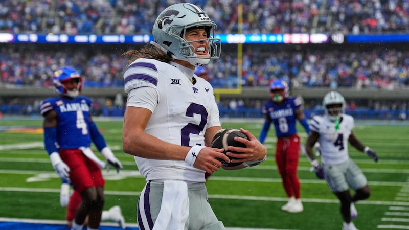 Kansas State quarterback Avery Johnson (2) celebrates after scoring a touchdown during the...