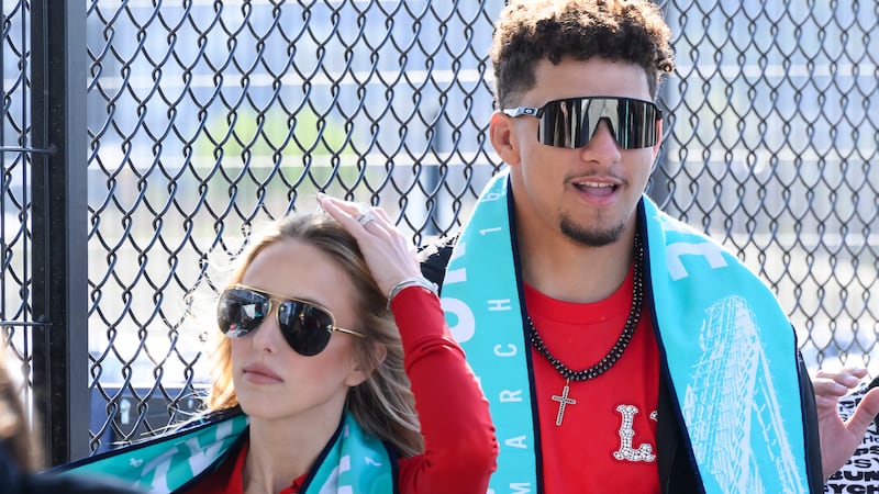 Kansas City Chiefs quarterback Patrick Mahomes, right, and his wife, Brittany Mahomes,...