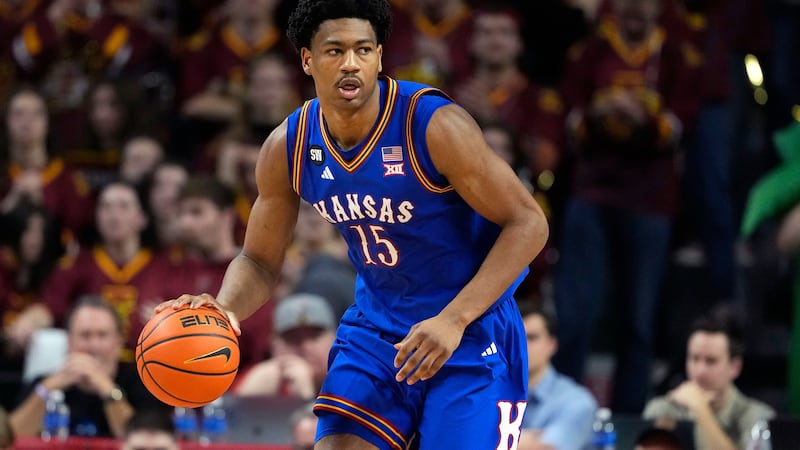 Kansas forward Bryson Tiller (15) drives the ball up the court during the first half of an...