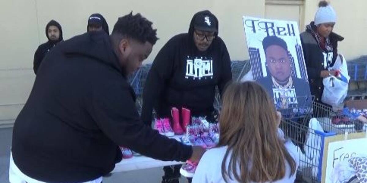 Topeka rapper hands out 300 pair of shoes to children