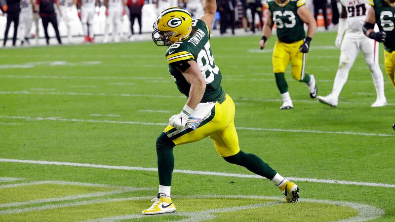 FILE: Green Bay Packers' Robert Tonyan (85) celebrates a touchdown reception during the first...