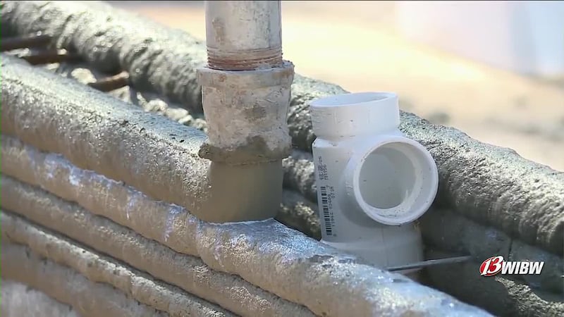 Concrete being layered onto the house in Topeka, Kansas