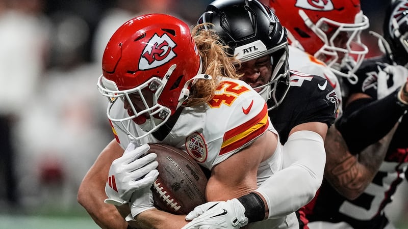 Kansas City Chiefs running back Carson Steele (42) runs against Atlanta Falcons linebacker...